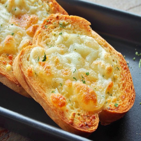 43624525 - close-up of a dish of garlic bread with cheese.